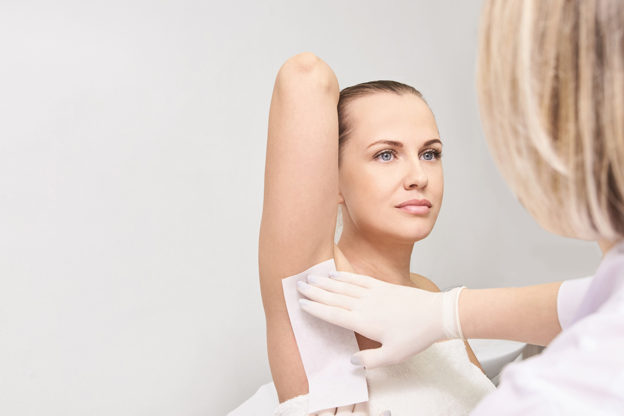 Woman Getting Her Underarms Waxed  